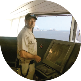 Captain Jeffrey Perlstein at the helm of a vessel